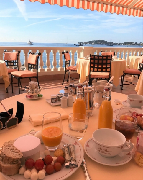 Tablescape overlooking a sea at breakfast.
